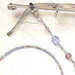 Beaded eyeglass leads